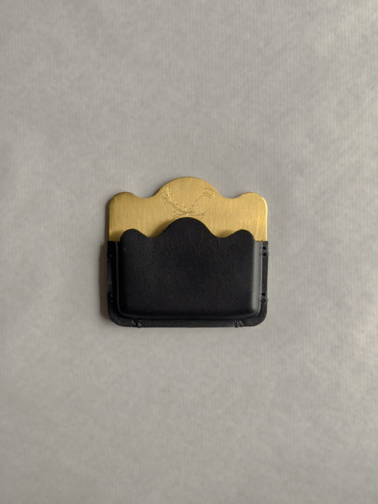 brass/black card holder with Dâder Bânu's hand detail