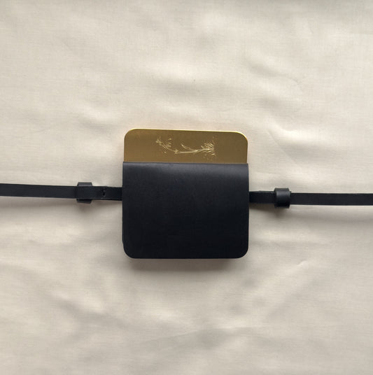 semi-treated brass/black leather flap belt bag with signature of Levnî