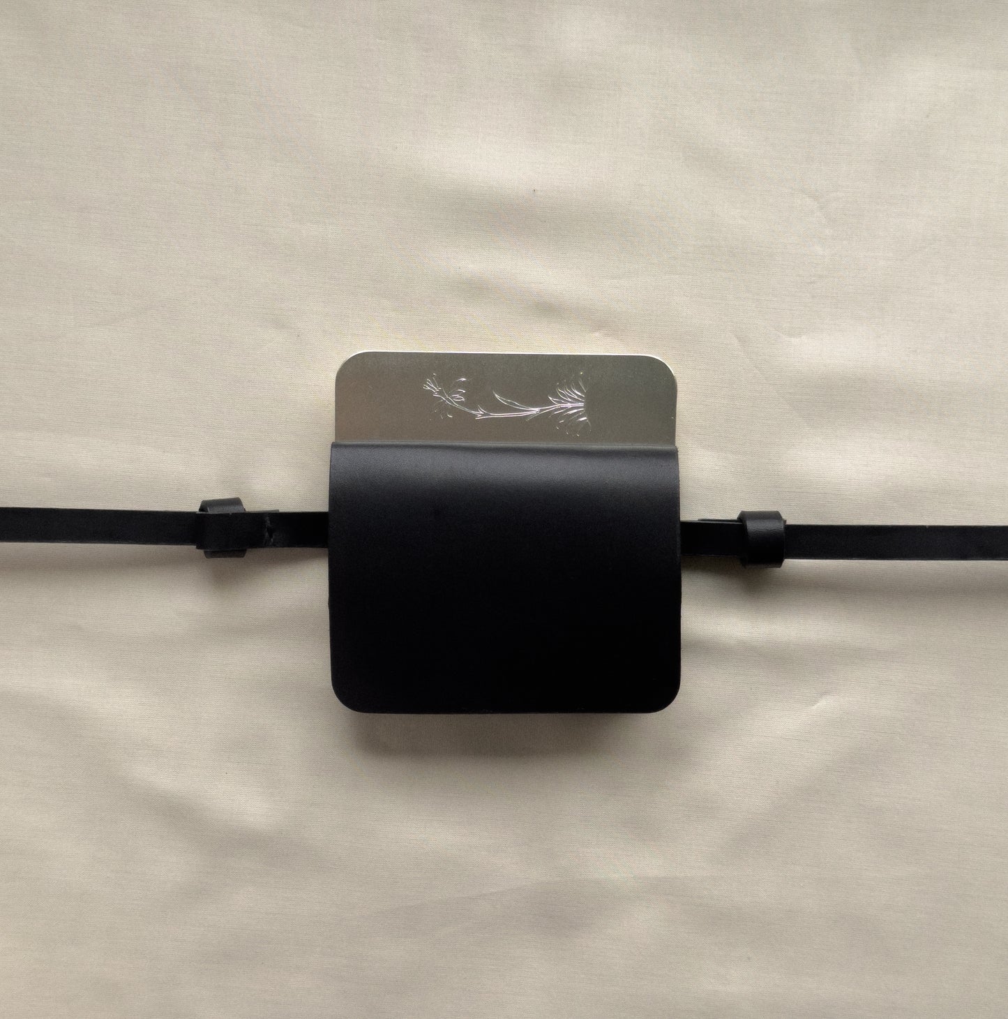 semi-treated silver coated brass/black flap belt bag with signature of Levnî